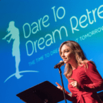 dare to dream logo with speaker in front